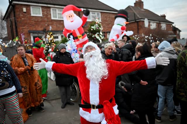 Kind-hearted locals clubbed together to cover the neighbourhood in Christmas decorations (Credit: National World/ SWNS)