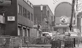 Looking down Victoria Street as work got underway to block pave the pavement