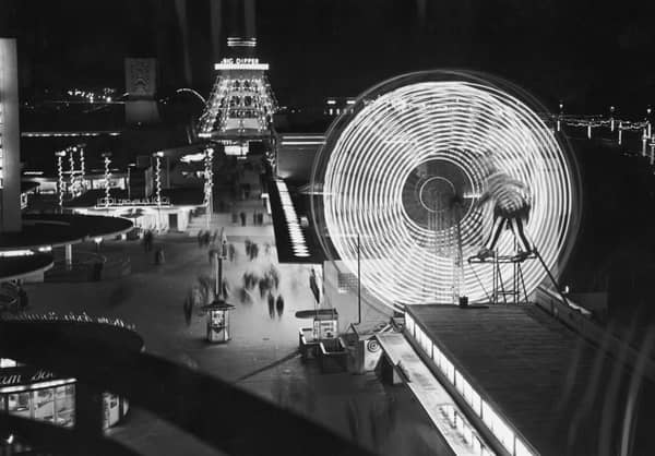 Illuminated rides at The Pleasure Beach in Blackpool, including a ferris wheel and the Big Dipper, 10th September 1955. (Photo by Fox Photos/Getty Images)