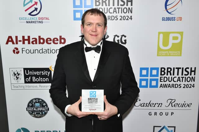 Head of Lancaster University School of Mathematics Pete Tiltman with his British Education Award 