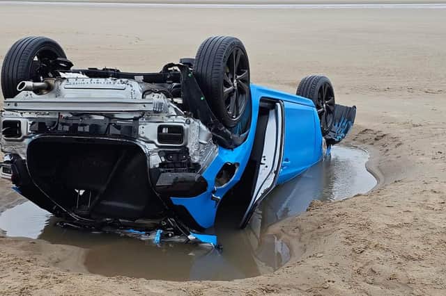 Parts of a Corsa and 206 convertible were spotted, partially buried in the sand opposite the new Hilton Hotel on Blackpool Promenade.
