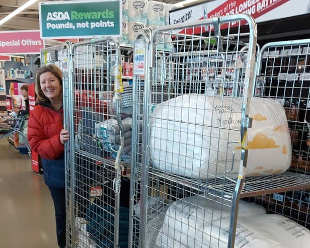 Volunteer Angela Butcher helping deliver some of the donated items