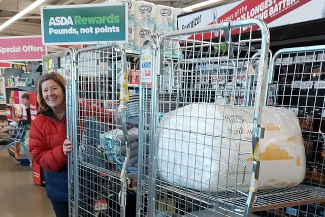 Volunteer Angela Butcher helping deliver some of the donated items