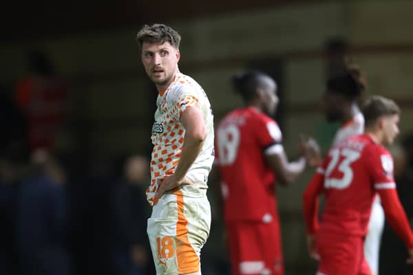 Jake Beesley cut a dejected figure at the full-time whistle after Blackpool's loss to Leyton Orient. Can the Seasiders still reach the play-offs? (Image: CameraSport - Rob Newell)