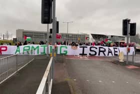 Protesters block the entrance to BAE Systems in Samlesbury in protest to the production of fighter jets which they say are being used by Israel against Palestinians in Gaza