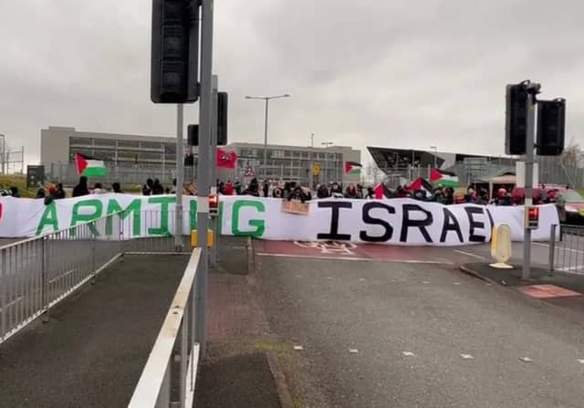 Protesters block the entrance to BAE Systems in Samlesbury in protest to the production of fighter jets which they say are being used by Israel against Palestinians in Gaza