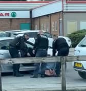 In the video, the officer was filmed dragging the driver out of a Ford Focus and wrestling him to the floor before stamping on his back as another officer applied handcuffs. He is then seen swinging a kick at the man's head and repeatedly slapping the suspect who was detained on the ground.