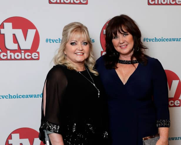 Coleen Nolan (R) has shared an emotional health update regarding her sister, Linda (L) (Photo by John Phillips/Getty Images) 