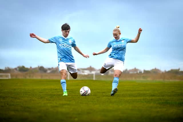 Rossall School students Campbell Reid and Maya Hansen in Man City kits