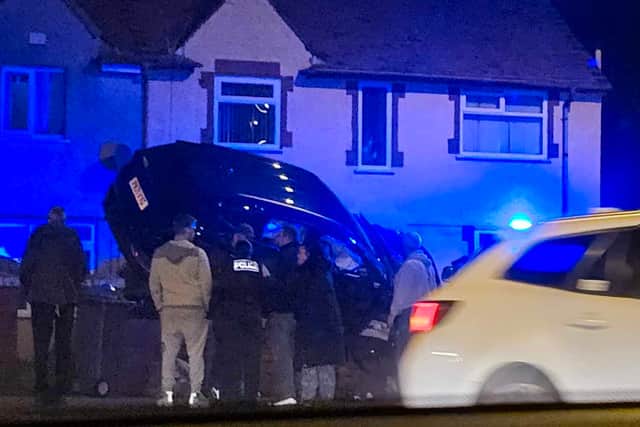 A car ends up on top of a garden wall in Blackpool after a collision. Picture: Shaney Evans
