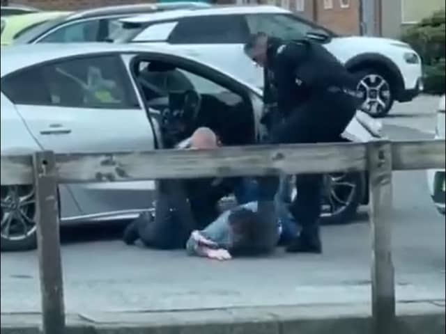 In the video, the officer was filmed dragging the driver out of a Ford Focus and wrestling him to the floor before stamping on his back as another officer applied handcuffs. He was then filmed swinging a kick at the man's head and repeatedly slapping the suspect who was detained on the ground.