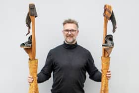 Charles Hanson with chicken leg stilts used in Star Wars (Credit: Hansons / SWNS)