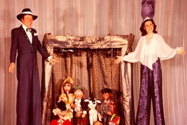 Peter & Sue Barbour performing their stilt act (Credit: Courtesy Sue Barbour / SWNS)