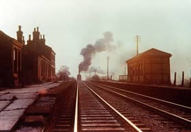 A cold winter's afternoon in the mid-1950s as the banking engine of a long freight works hard up Whalley Bank after passing through Langho station. Ken Roberts from Freight Trains in the North of England by John Matthews