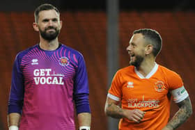 Mark Howard (L) won promotion to the Sky Bet League One at the weekend. He along with Elliot Lee (not pictured) play for Wrexham. 