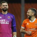 Mark Howard (L) won promotion to the Sky Bet League One at the weekend. He along with Elliot Lee (not pictured) play for Wrexham. 