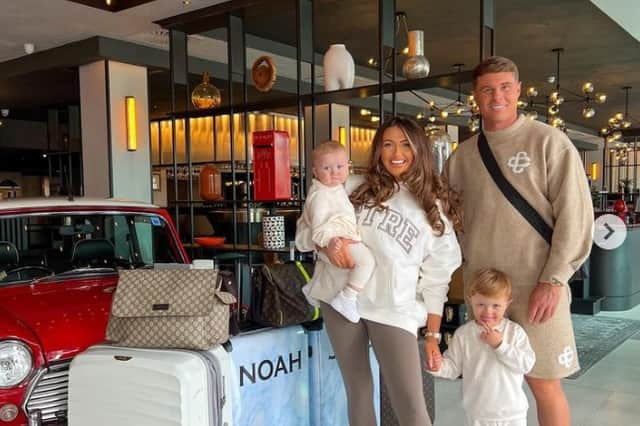 Charlotte Dawson with fiance Matthew Sarsfield and their two sons, Noah and Jude, at Heathrow Airport.