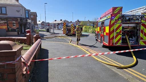 Firefighters at the junction of Caunce Street and Manchester Road. Photo: Lucinda Herbert