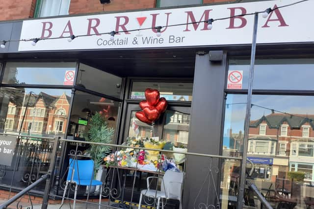 Floral tributes outside Selvan's bar in Wood Street, St Annes this morning