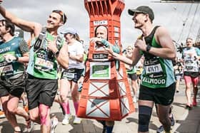 Tony posing for a selfie with other marathon runners.