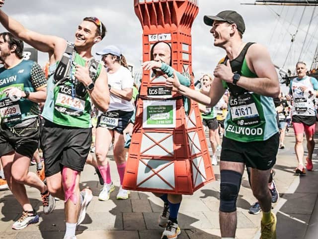 Tony posing for a selfie with other marathon runners.