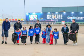 Sea Life Girlguides at a beach clean and badge presentation. 