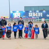 Sea Life Girlguides at a beach clean and badge presentation. 