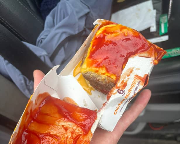 Lucie's ketchup-smeared and bun-less triple cheeseburger from McDonald's at Squires Gate, Blackpool