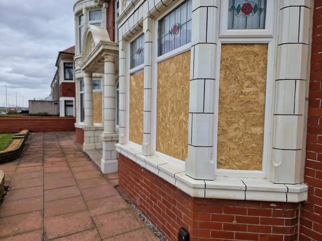 The boarded-up windows at the house on Bispham prom following the targeted vandal spree.