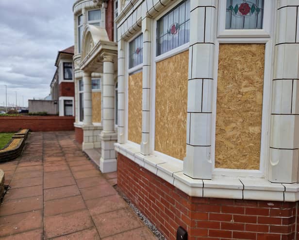 The boarded-up windows at the house on Bispham prom following the targeted vandal spree.