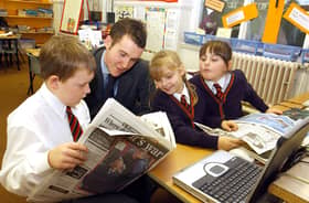 Former Gazette reporter Andy Sykes talks to children at Waterloo Primary School in Blackpool about life working at a newspaper. L-R are Sophie Fletcher (9), Rachel Clarke (9) and Ryan Clarkin (8)