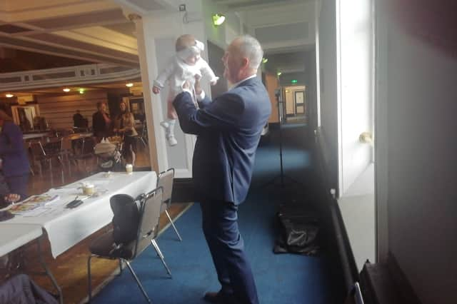 Clive Grunshaw celebrates his victory with his granddaughter Arabella