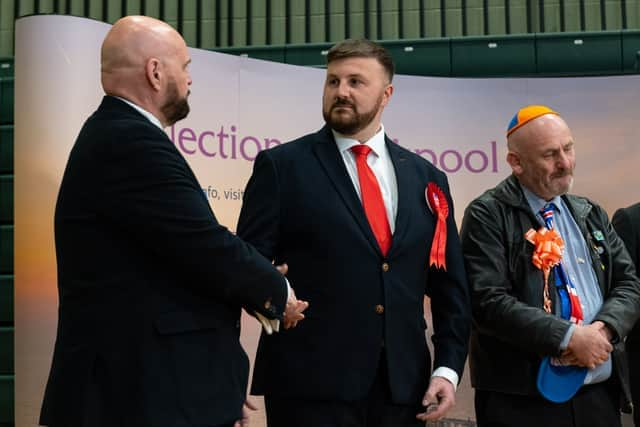 Chris Webb shakes hands with Conservative candidate David Jones following the result