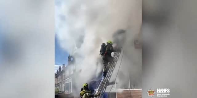 Firefighter rescues man from burning flat.