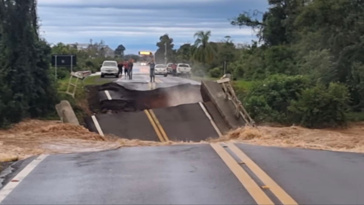 Watch: Bridge collapses into river as man narrowly avoids falling in