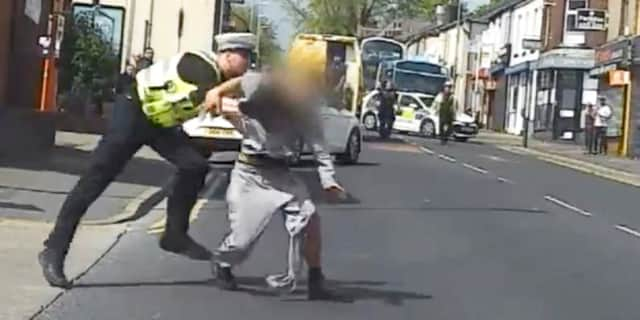 Police officer tackles suspected bike thief to ground.