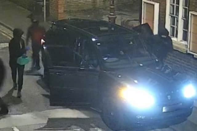 CCTV captured masked thugs climbing out of a Range Rover before smashing windows and trying to set fire to The Cube in Breck Road, Poulton in April 2024