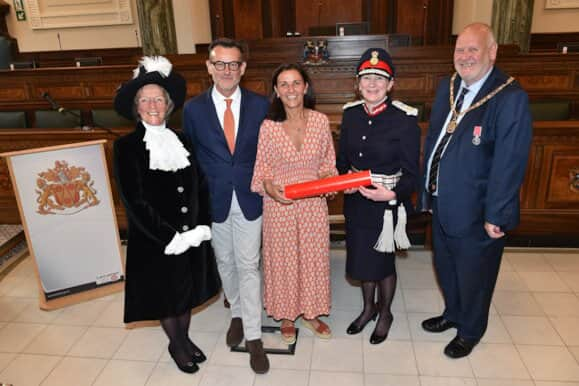 Tim Hislop and Gill Stratton of Floss Rock (middle) celebrating their award with important members of Lancashire County Council.