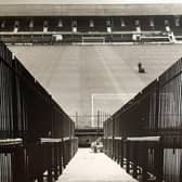 The caption on the back of this 1971 photo says 'A policeman's view of the Bloomfield Road pitch from the Kop which is being divided to split rival fans'