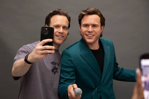 Olly takes a picture with his new Madame Tussauds figure