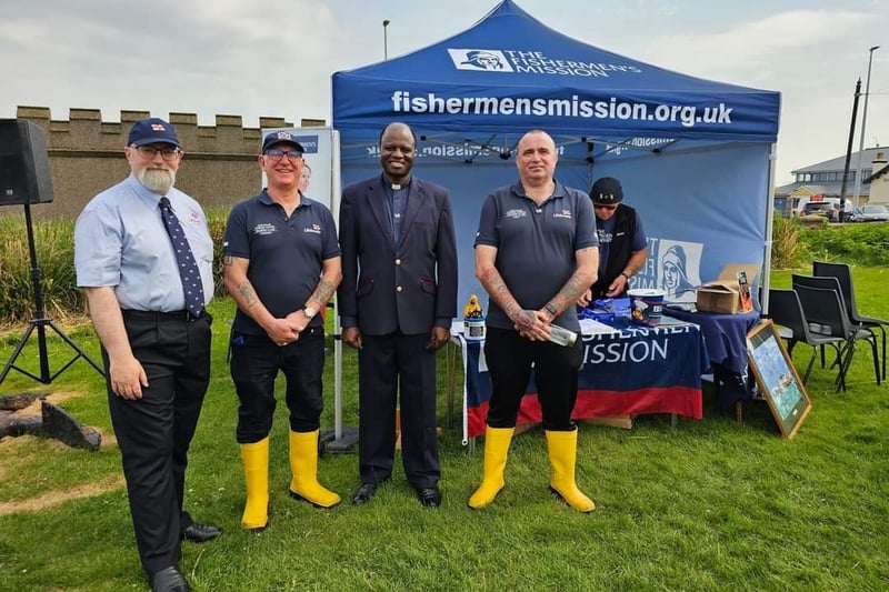 The Rev George Ayoma (centre) with members of Fleetwood RNLI at the town's inaugural National Fishing Remembrance event. Photo: Maureen Blair (Ravenswood Photography & Media)
