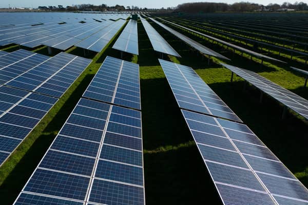 Photovoltaic (PV) solar panels making up Manston Solar Farm in south-east England. (Photo by DANIEL LEAL/AFP via Getty Images)