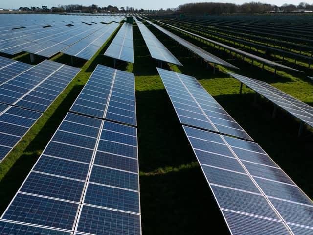 Photovoltaic (PV) solar panels making up Manston Solar Farm in south-east England. (Photo by DANIEL LEAL/AFP via Getty Images)