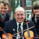 Blackpool Lions present musical instruments to Waterloo Primary School. Pictured L-R Alex Kay, President of Blackpool Lions Ken Ogden and Toni Thompson