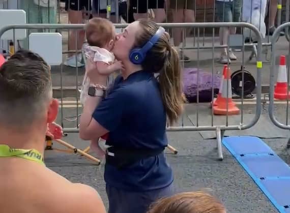 Megan McWhinney crosses the finish line at the Beaverbrooks Blackpool 10k with her 11-week-old daughter Fern
