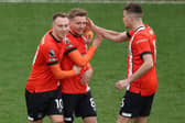 Released Luton Town midfielder Luke Berry, centre