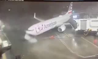 Plane blown away from airport gate by ferocious 80mph winds.