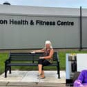 Sue Rayner and the memorial bench in tribute to her husband, swimming teacher Barrie (inset)