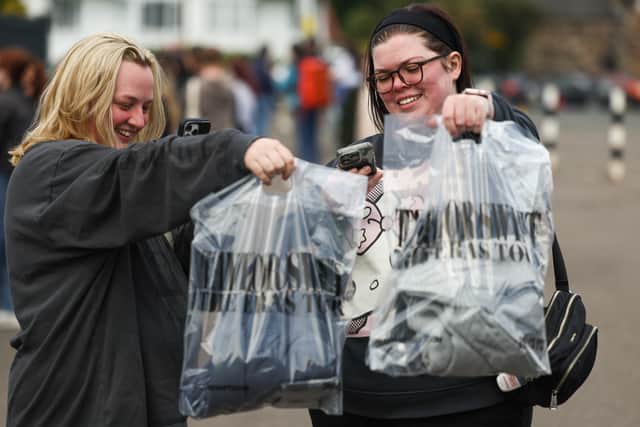 Taylor Swift fans with their bags of merchandise outside Murrayfield stadium in Edinburgh. (Photo by Jeff J Mitchell/Getty Images)