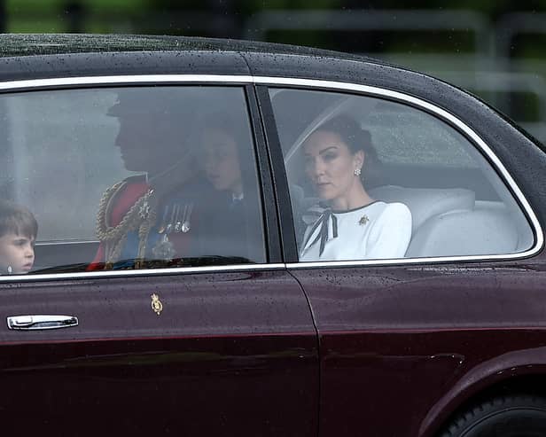 Catherine, Princess of Wales  arrives with Prince William, Prince of Wales  and their children Prince George and Prince Louis of Wales to Buckingham Palace before the King's Birthday Parade "Trooping the Colour". (Photo by HENRY NICHOLLS/AFP via Getty Images)